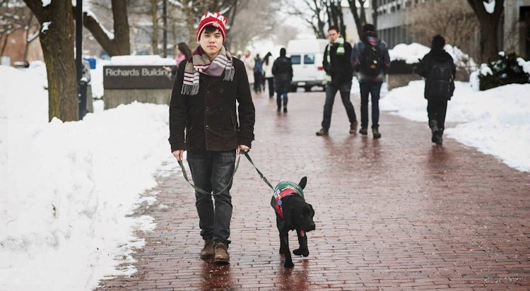 Marcus Chu with Dog - On Campus walkway