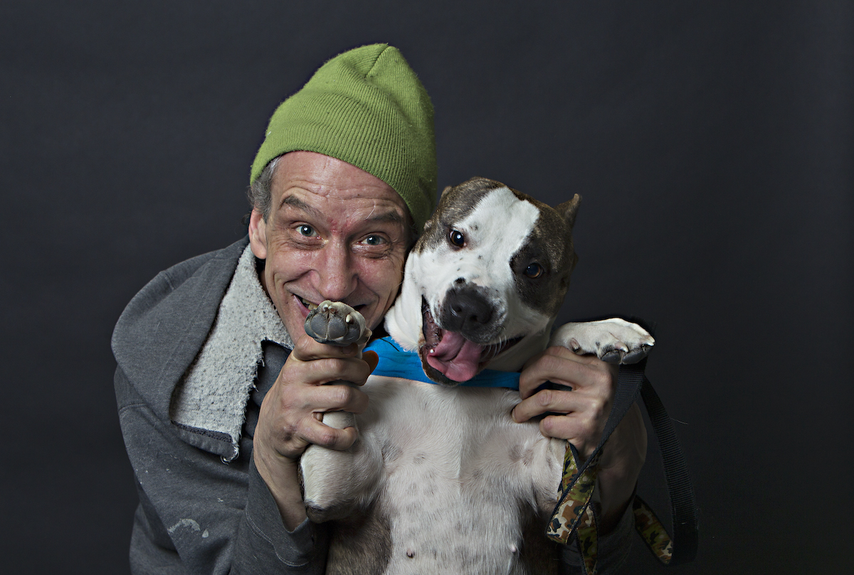 A Community Veterinary Outreach client and his healthy dog. (Courtesy CVO)