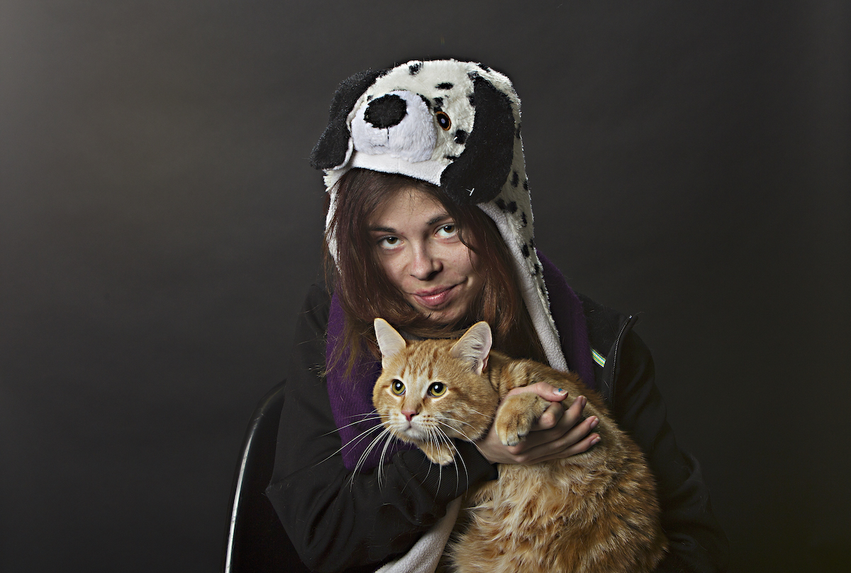 A Community Veterinary Outreach client and her healthy cat. (Courtesy CVO)
